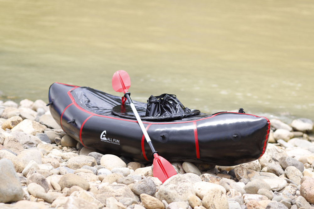 Single person whitewater packraft